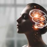 Profile silhouette of a woman with a glowing brain illustration