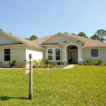 Rent-to-Own SHOCKER: Buyers Beware Hidden Costs! Large house with a for sale sign